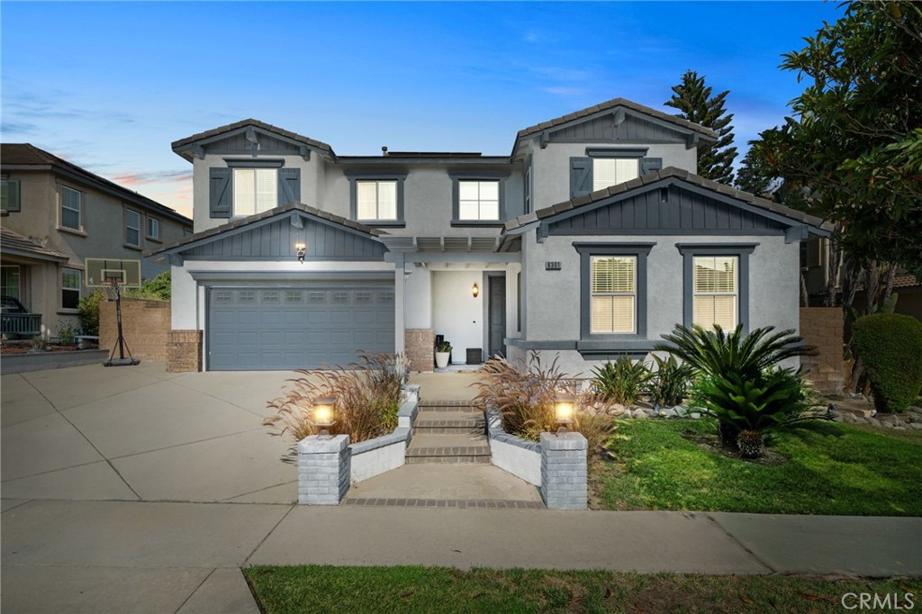 6301 Sandhill Place Rancho Cucamonga, CA 91739 - Photo 1 of 1 a front view of a house with garden