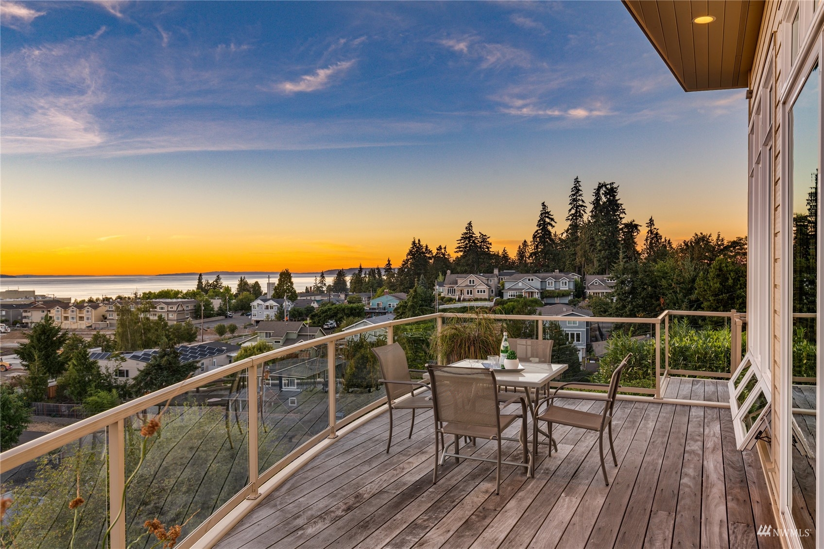 731 Bell Street Edmonds, WA 98020 - Photo 12 of 40 a view of a balcony with mountain view and wooden floor