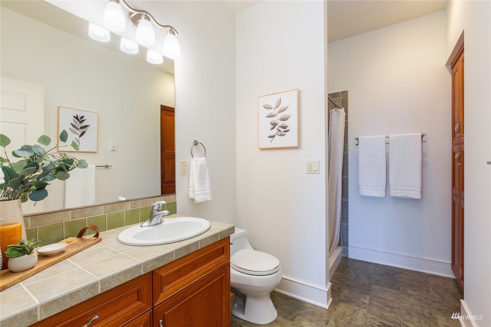 731 Bell Street Edmonds, WA 98020 - Photo 20 of 40 a bathroom with a granite countertop sink toilet and shower