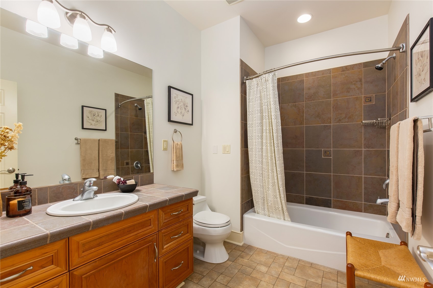 731 Bell Street Edmonds, WA 98020 - Photo 25 of 40 a bathroom with a granite countertop sink toilet and shower