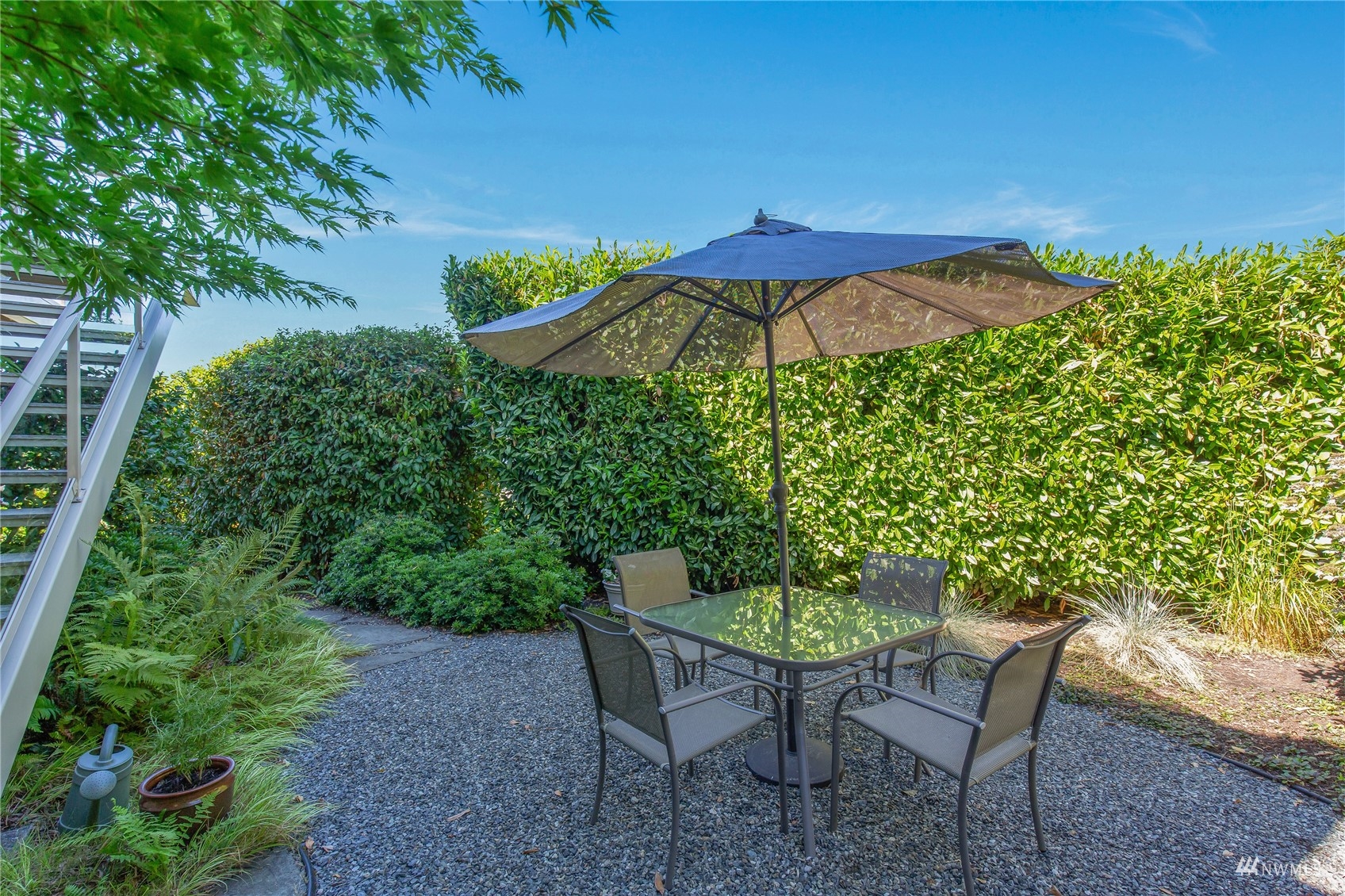 731 Bell Street Edmonds, WA 98020 - Photo 33 of 40 a patio with a patio table and chairs