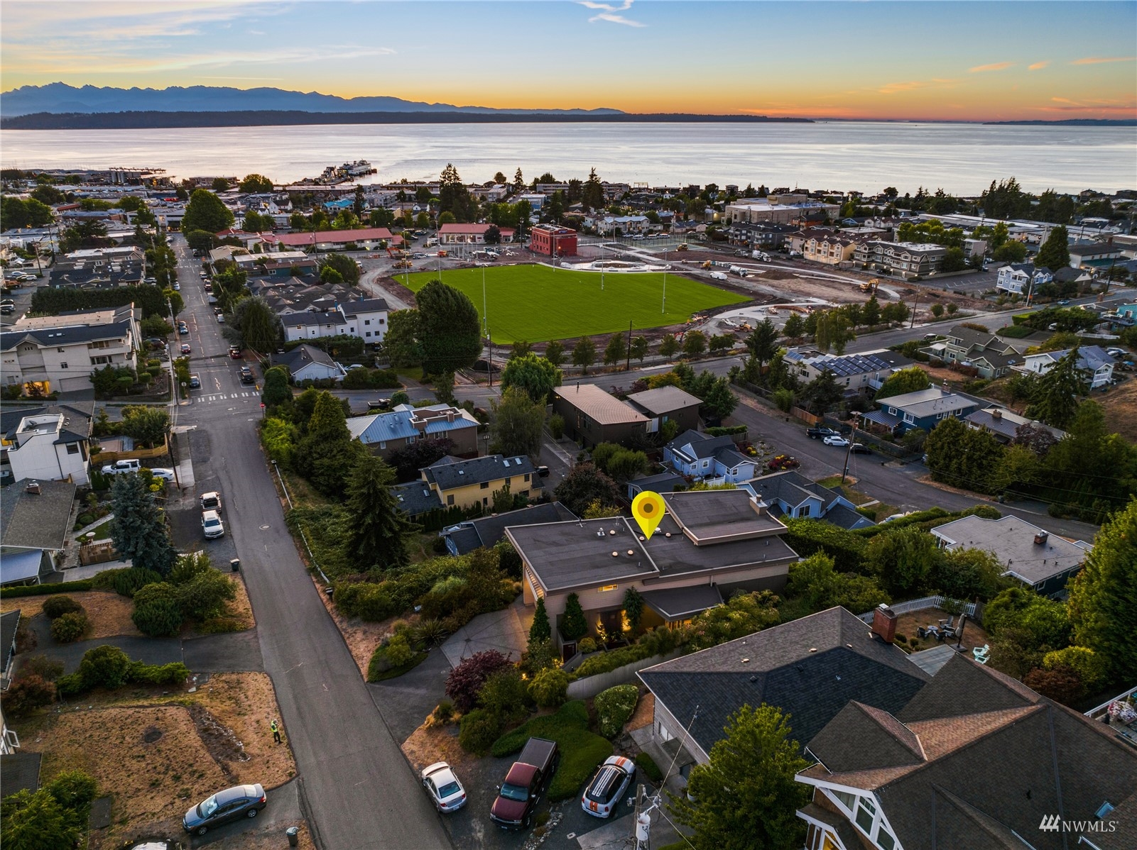 731 Bell Street Edmonds, WA 98020 - Photo 39 of 40 an aerial view of a resort with a swimming pool outdoor seating and yard