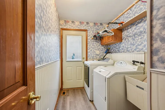 a view of bathroom with a washer and dryer