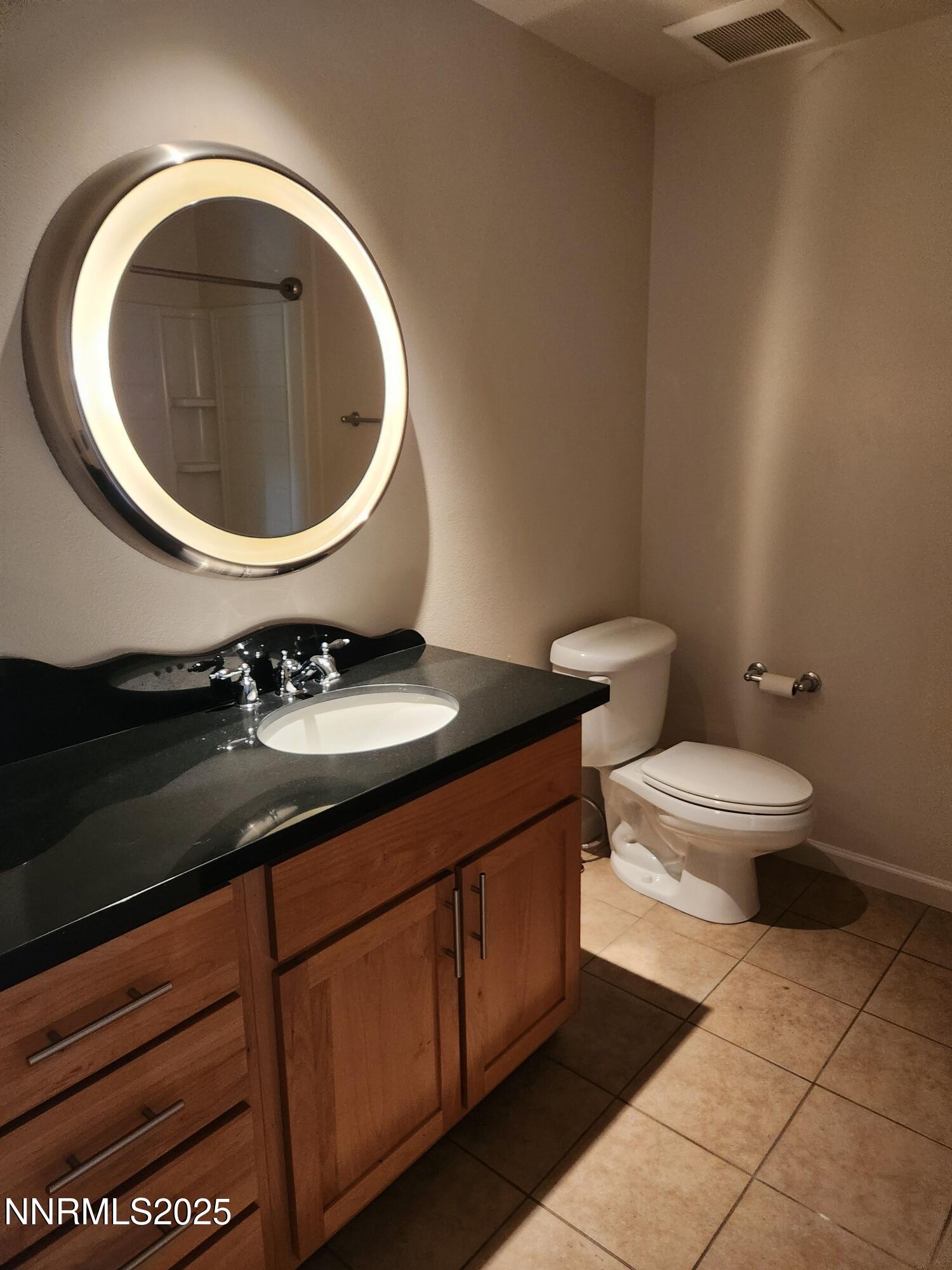 1450 Idlewild Drive, Unit 1133 Reno, NV 89509 - Photo 5 of 6 a bathroom with a sink and a toilet