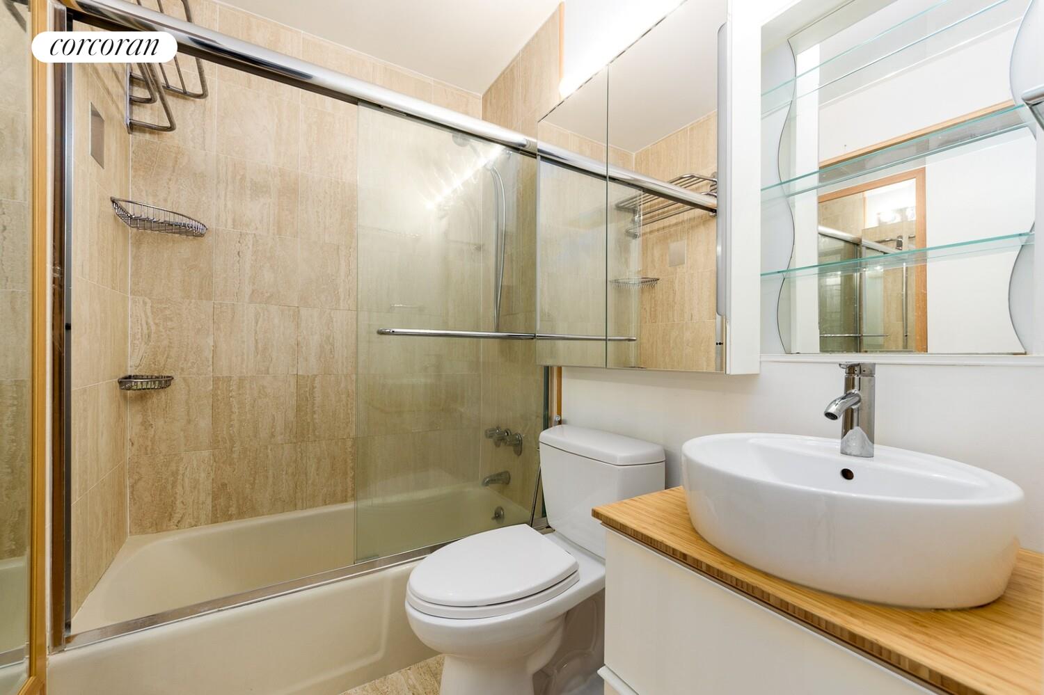 176 West 86th Street, Unit 5B Manhattan, NY 10024 - Photo 5 of 10 a bathroom with a sink and a mirror