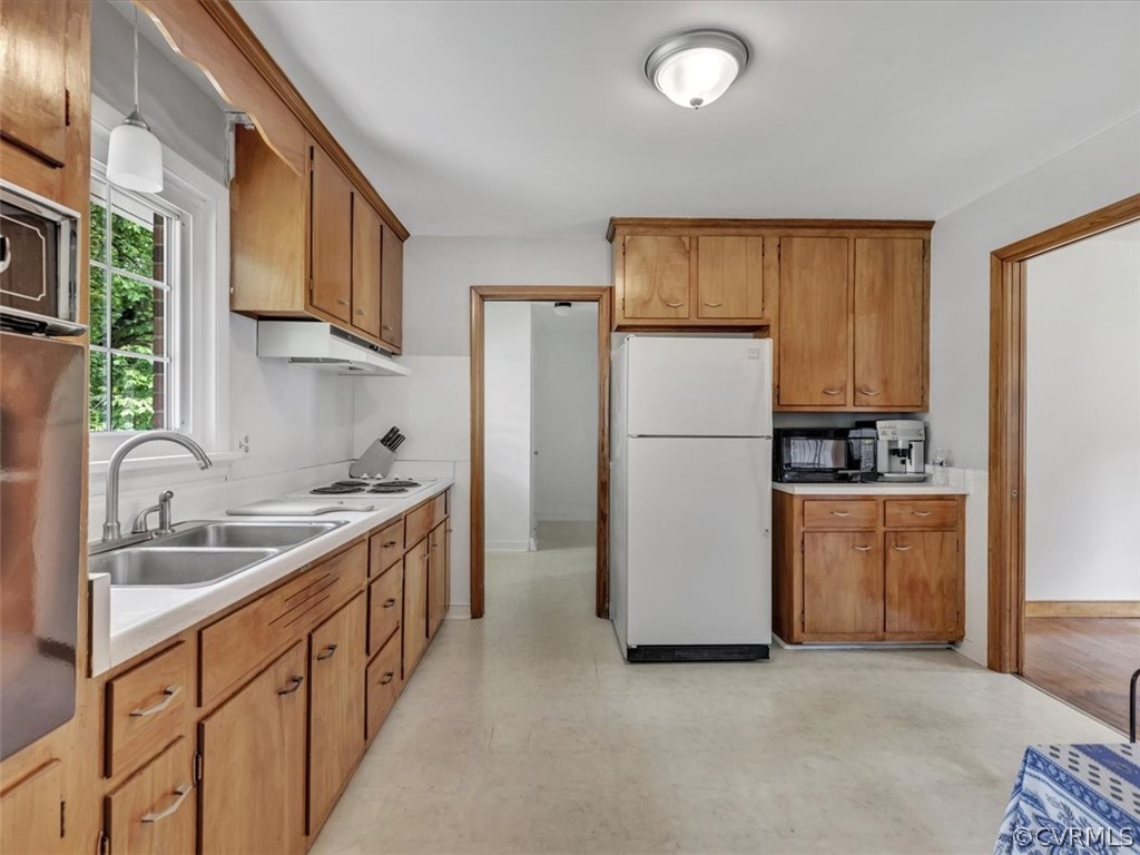 4140 Holcombe Road Richmond, VA 23234 - Photo 11 of 18 a kitchen with stainless steel appliances granite countertop a refrigerator a stove a sink and a refrigerator