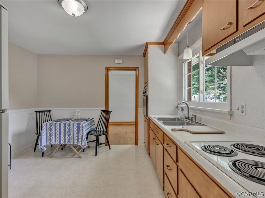4140 Holcombe Road Richmond, VA 23234 - Photo 12 of 18 a kitchen that has a sink and a stove in it