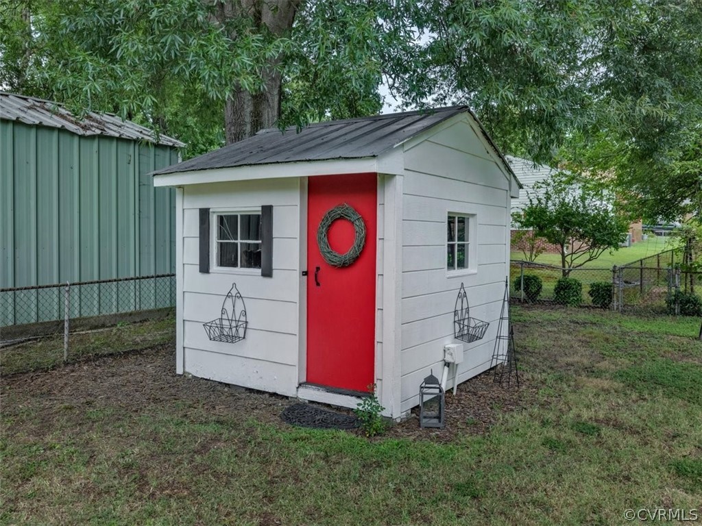 4140 Holcombe Road Richmond, VA 23234 - Photo 16 of 18 a view of a house with a backyard