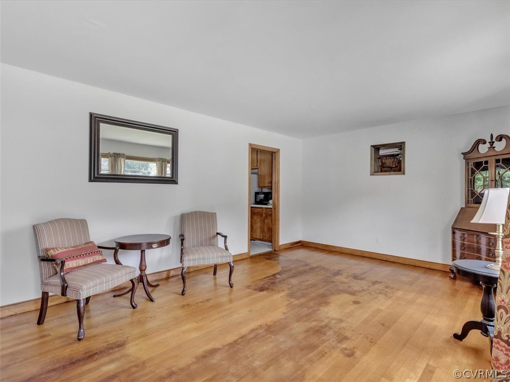 4140 Holcombe Road Richmond, VA 23234 - Photo 2 of 18 a view of room with lounge chair and wooden floor