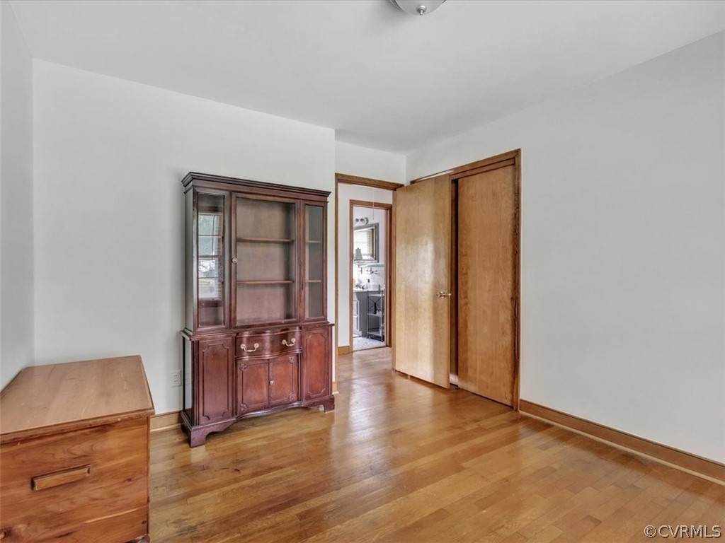 4140 Holcombe Road Richmond, VA 23234 - Photo 8 of 18 an empty room with wooden floor and windows