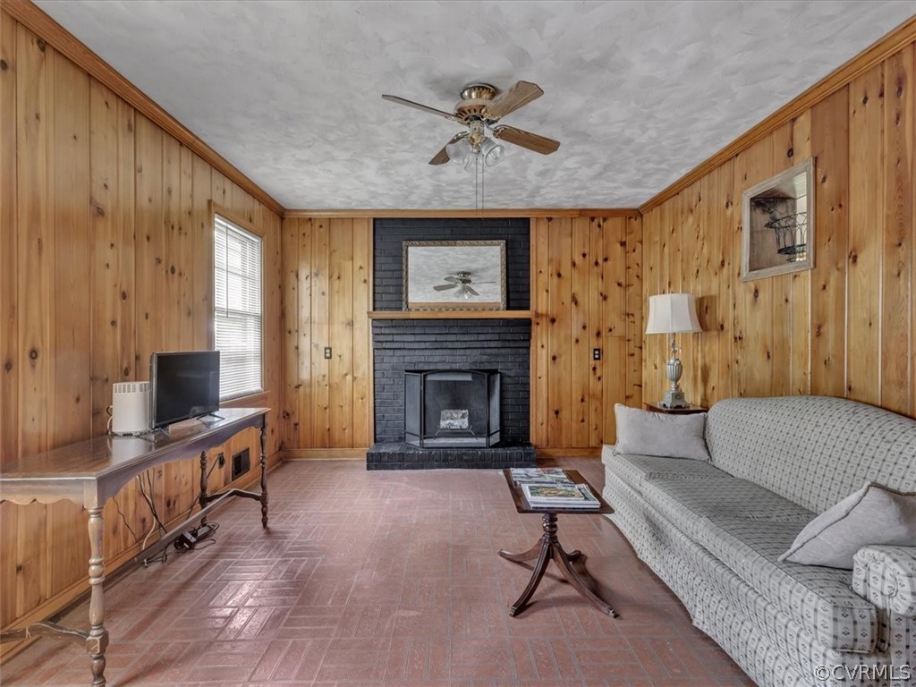 4140 Holcombe Road Richmond, VA 23234 - Photo 10 of 18 a living room with furniture and a fireplace