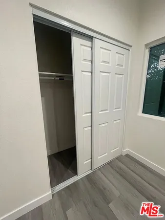 an empty room with wooden floor