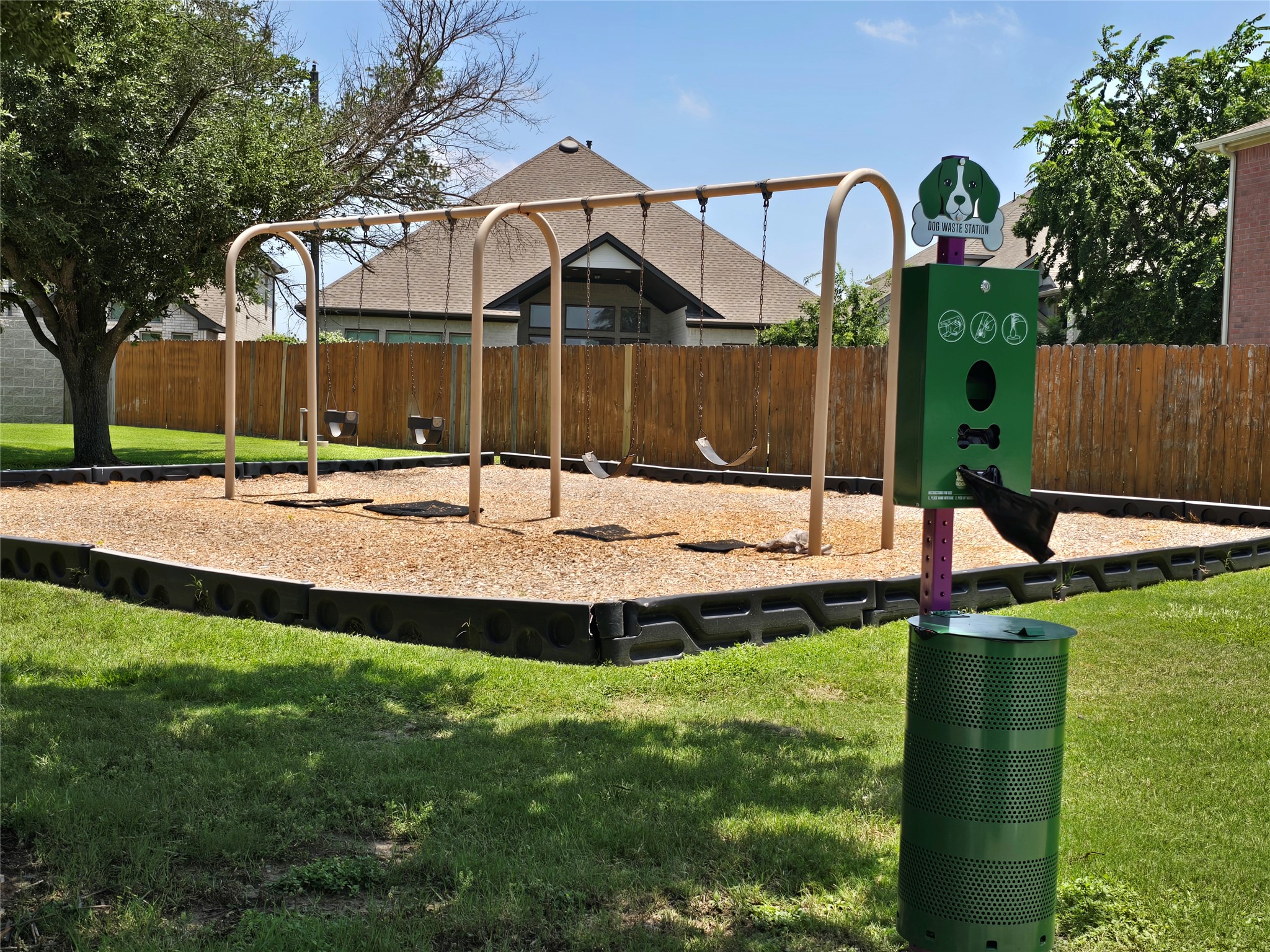 2021 Rim Rock Drive Leander, TX 78641 - Photo 11 of 14 A community playground, perfect for outdoor fun, features a dog waste station for convenience.