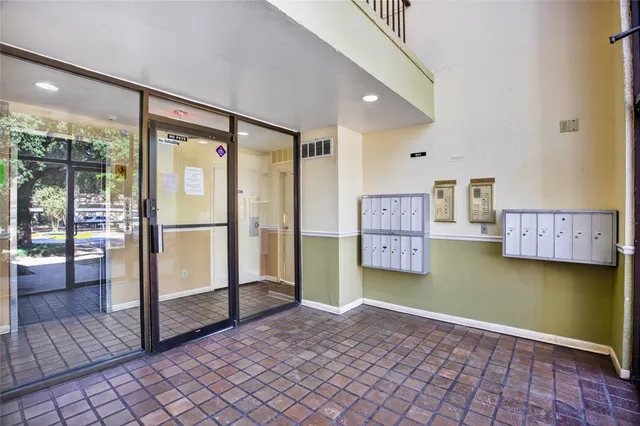 a view of an house with swimming pool and porch