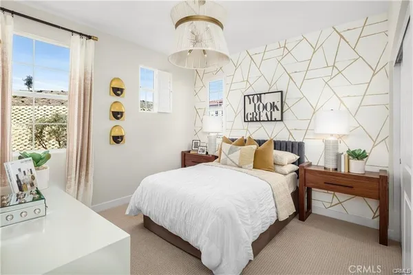 a bedroom with a bed and a table in it