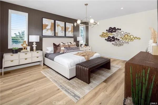 a spacious bedroom with a bed mirror and window