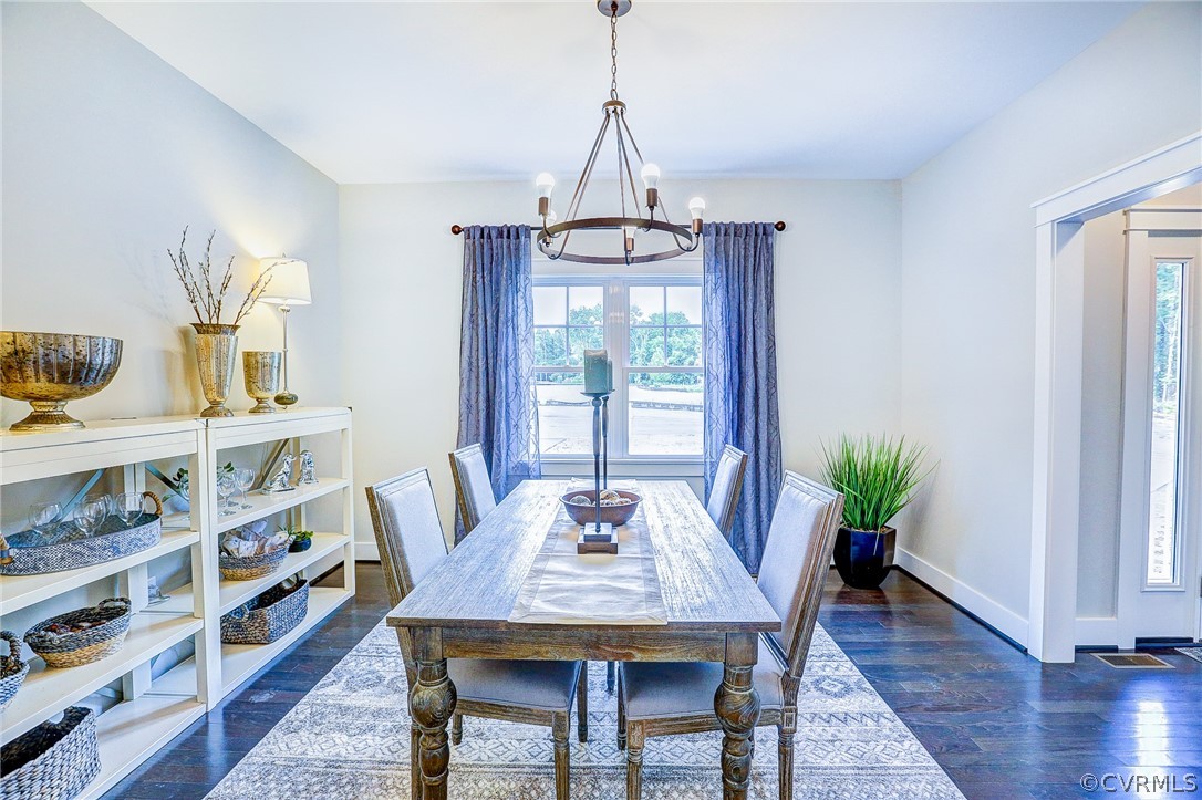 7213 Appelman Road Chesterfield, VA 23832 - Photo 4 of 18 a view of a dining room with furniture window and wooden floor