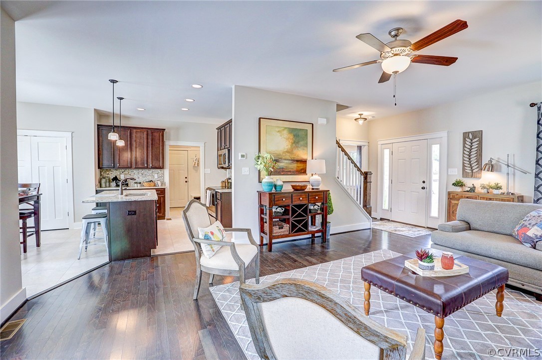 7213 Appelman Road Chesterfield, VA 23832 - Photo 10 of 18 a living room with furniture kitchen view and a wooden floor