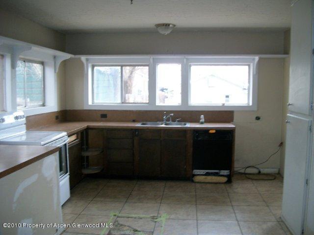 1024 Munro Avenue Rifle, CO 81650 - Photo 3 of 3 a kitchen with a sink and a stove