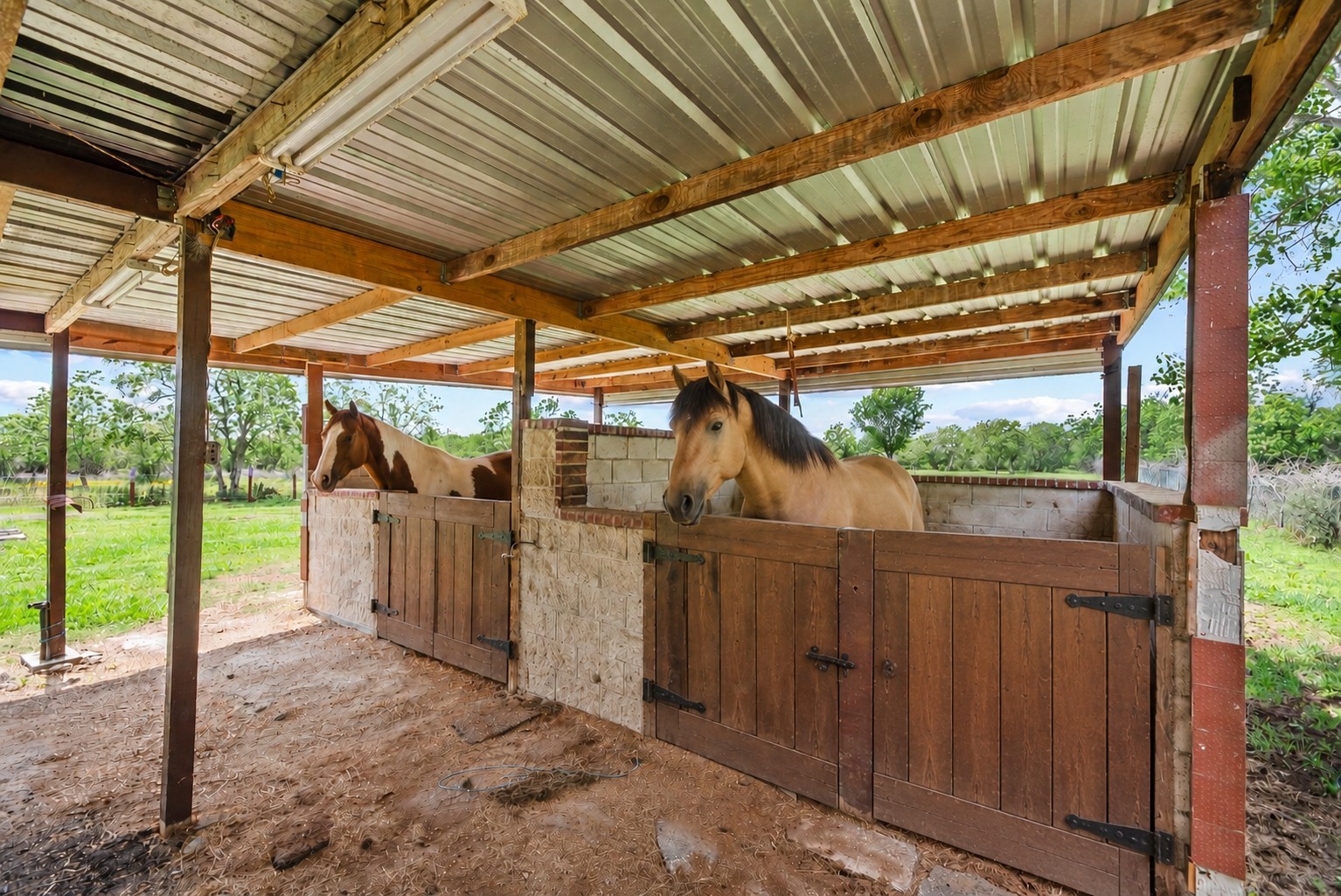 523 Moore Bar Road Rosenberg, TX 77471 - Photo 13 of 50 Horse stables virtually staged with doors added.