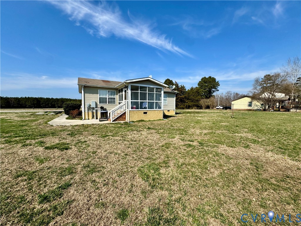 13531 Raynor Road Ivor, VA 23866 - Photo 3 of 16 a front view of a house with a yard