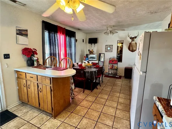 a kitchen with stainless steel appliances granite countertop a refrigerator and a stove