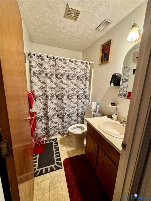 13531 Raynor Road Ivor, VA 23866 - Photo 10 of 16 a bathroom with a sink toilet and shower