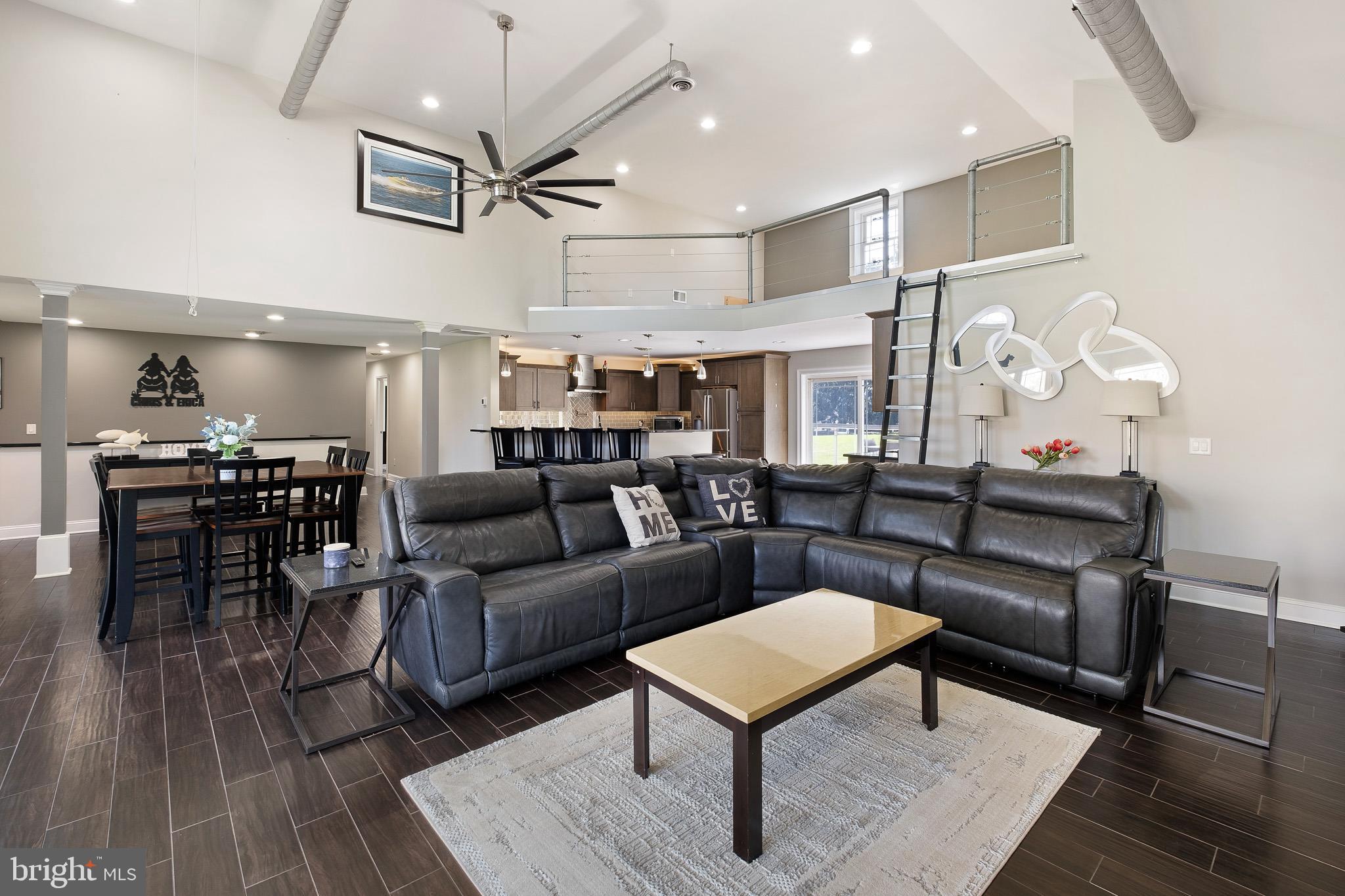 314 Concord Road Glen Mills, PA 19342 - Photo 14 of 42 a living room with furniture a rug and kitchen view
