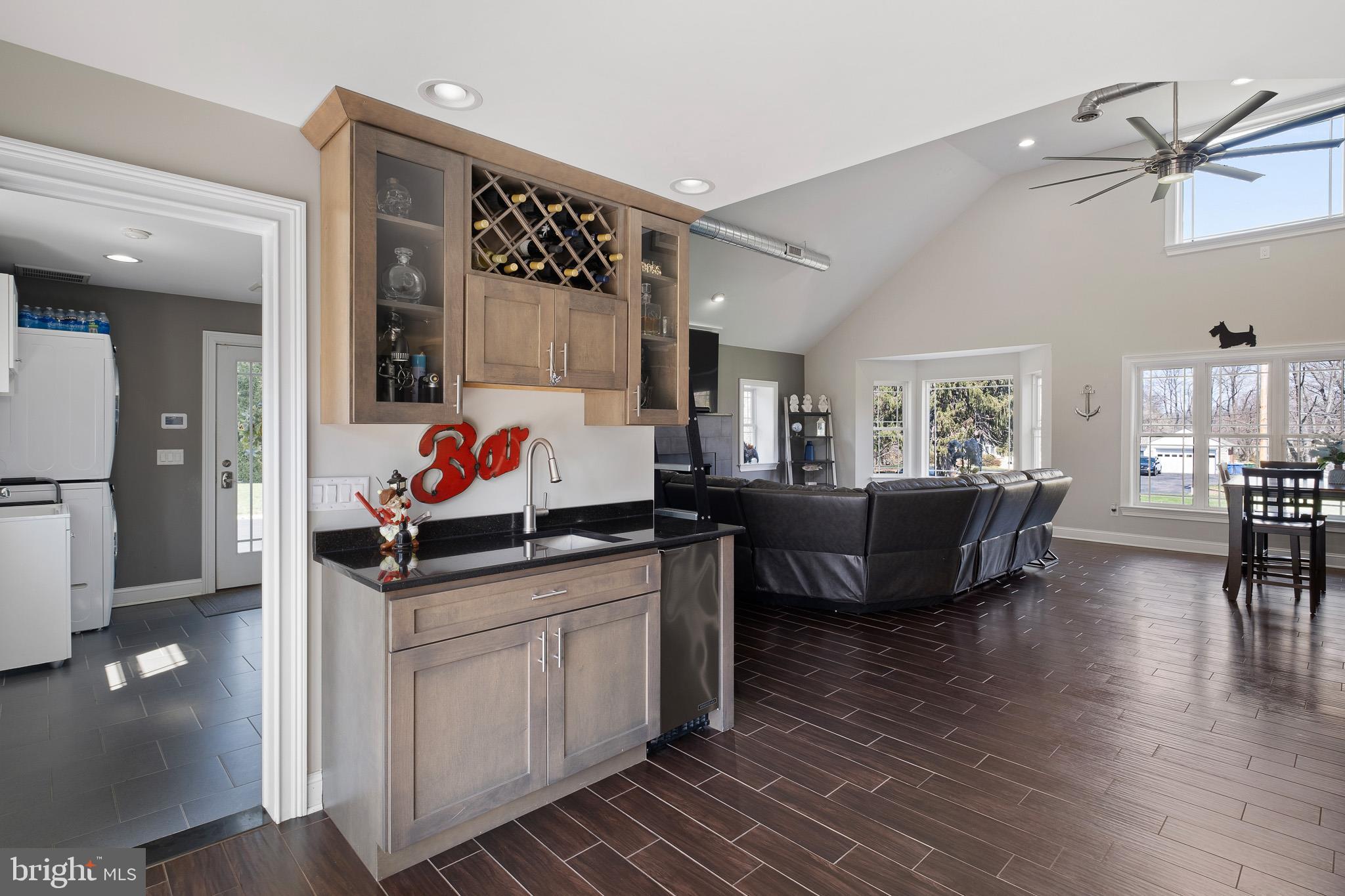 314 Concord Road Glen Mills, PA 19342 - Photo 18 of 42 a living room with granite countertop furniture a rug and a chandelier
