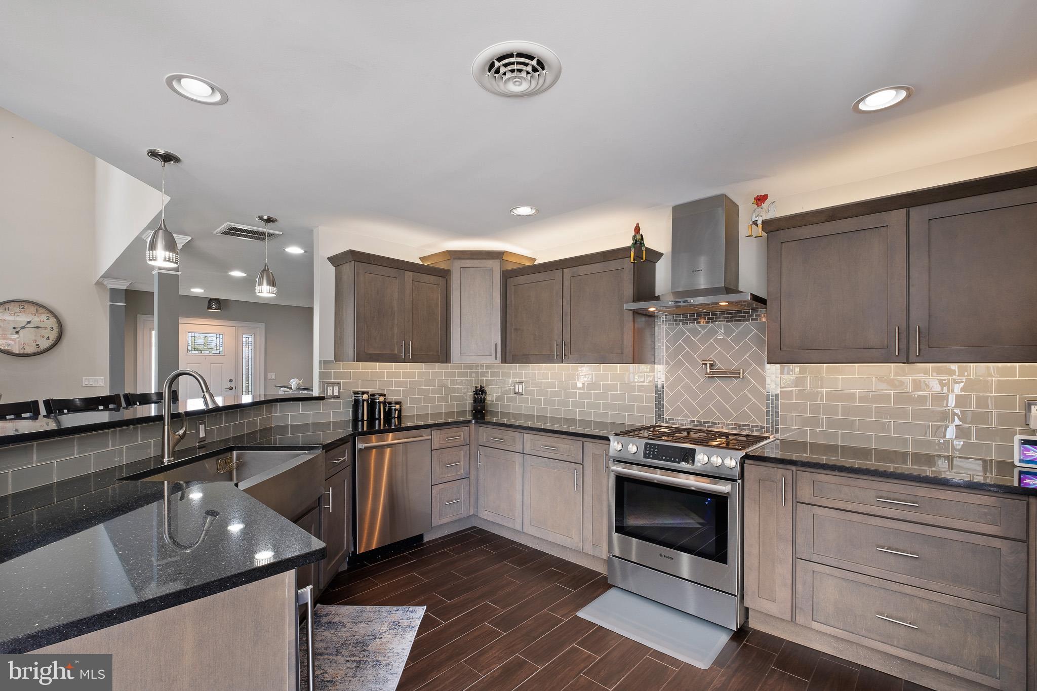 314 Concord Road Glen Mills, PA 19342 - Photo 21 of 42 a kitchen with stainless steel appliances a sink stove and cabinets