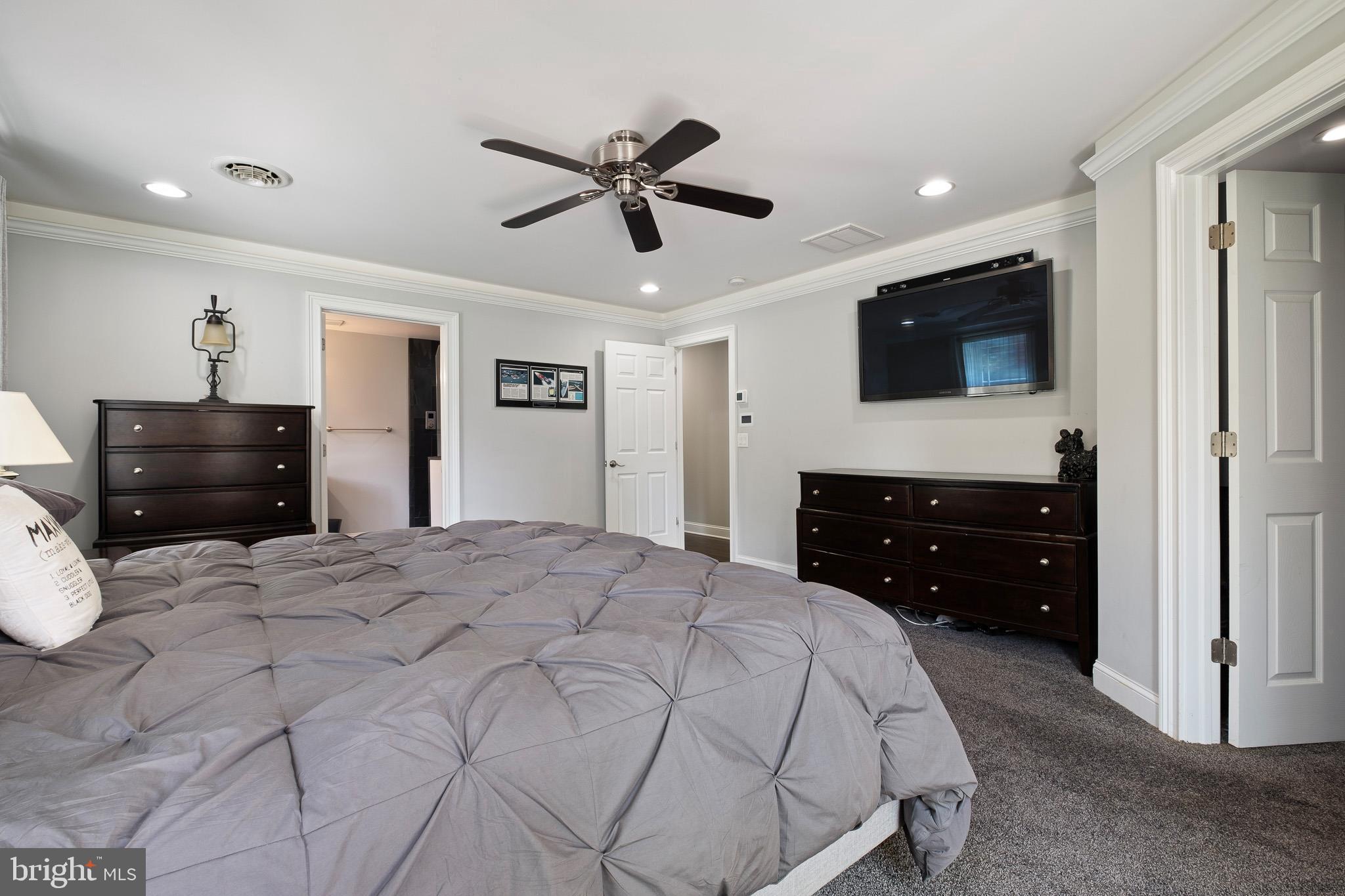 314 Concord Road Glen Mills, PA 19342 - Photo 25 of 42 a bedroom with a bed and a flat screen tv