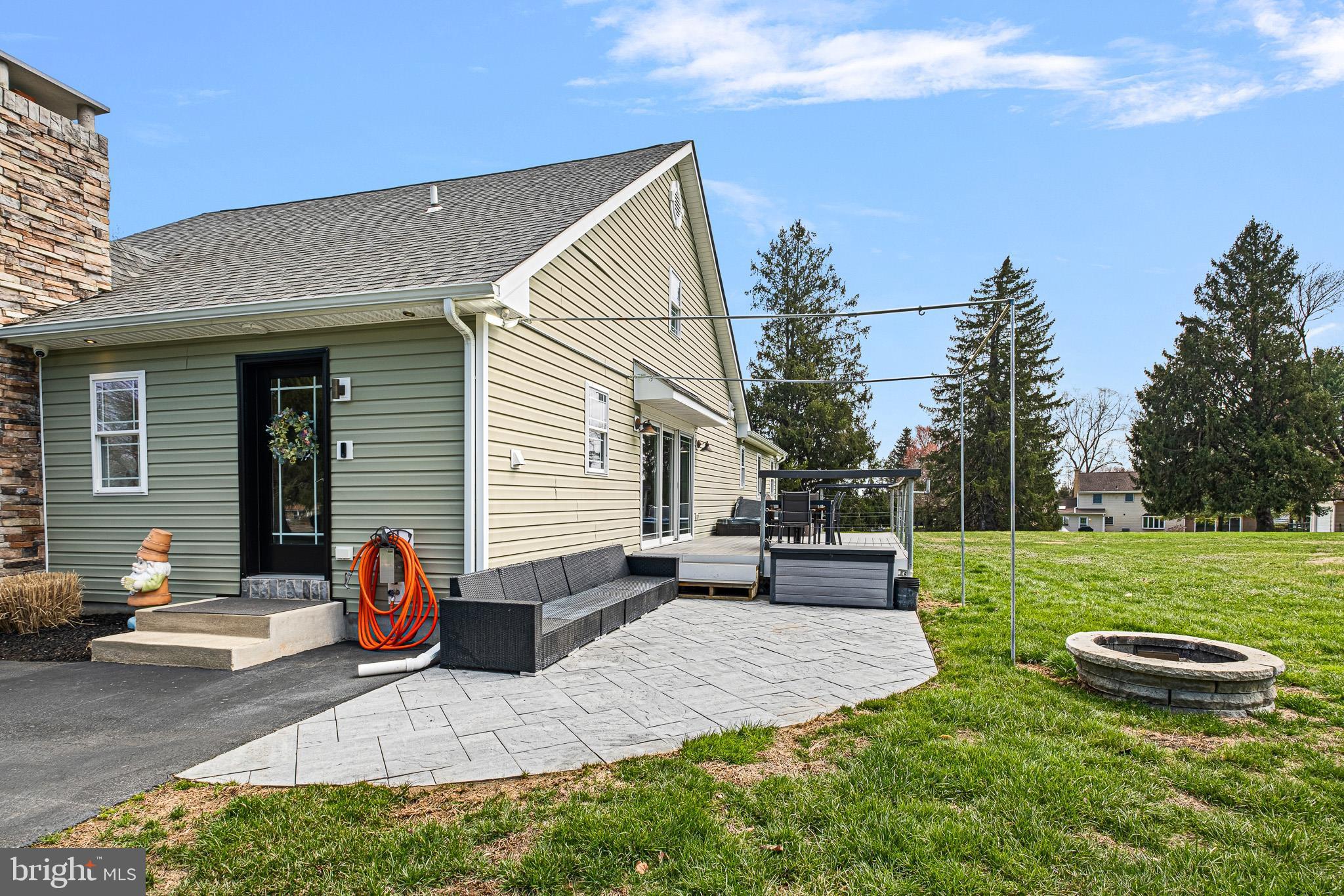 314 Concord Road Glen Mills, PA 19342 - Photo 7 of 42 a view of a patio with chairs and a yard