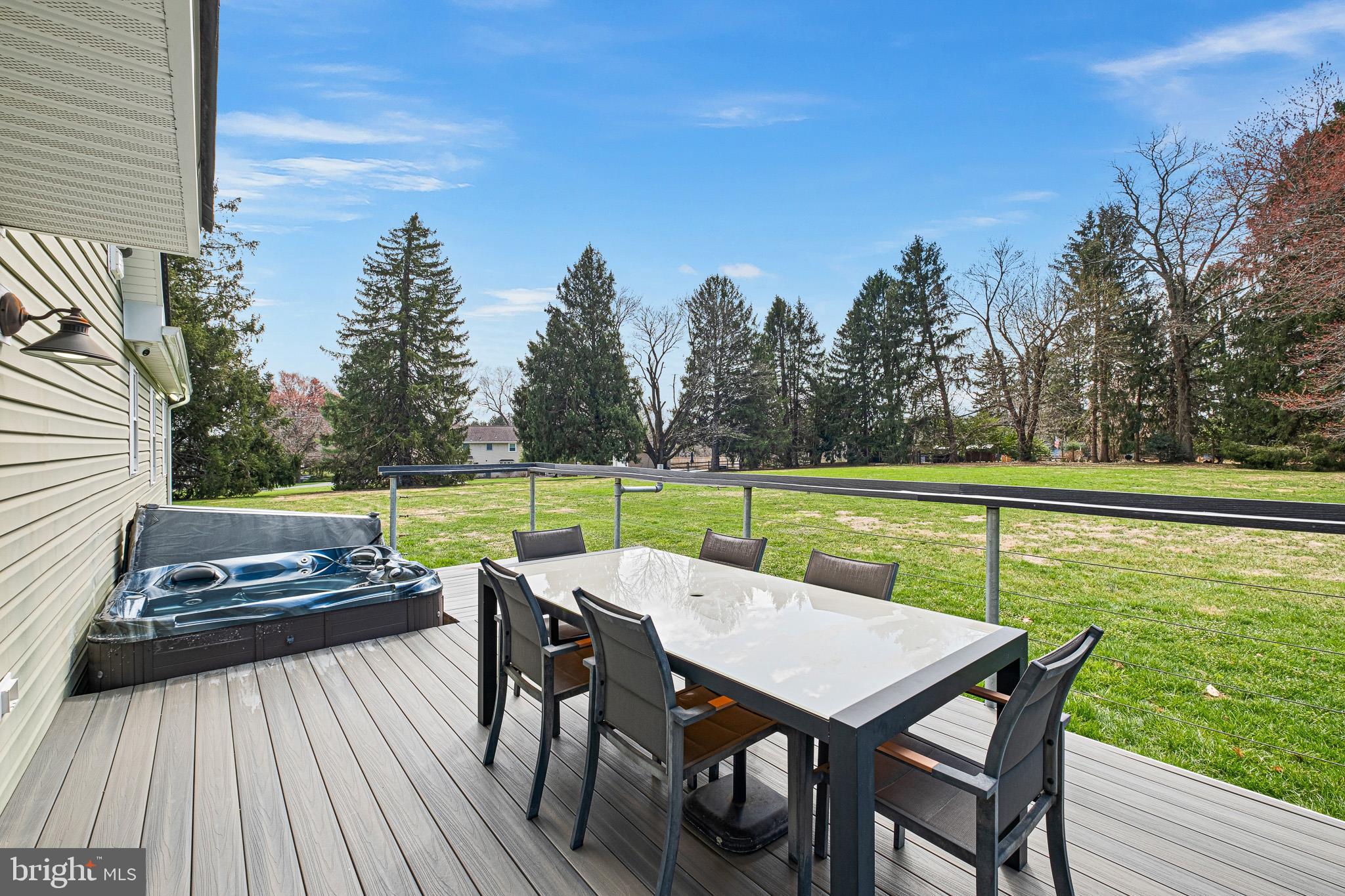314 Concord Road Glen Mills, PA 19342 - Photo 8 of 42 a view of a chairs and table on the deck