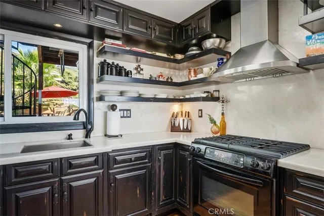 a kitchen with a stove and a sink