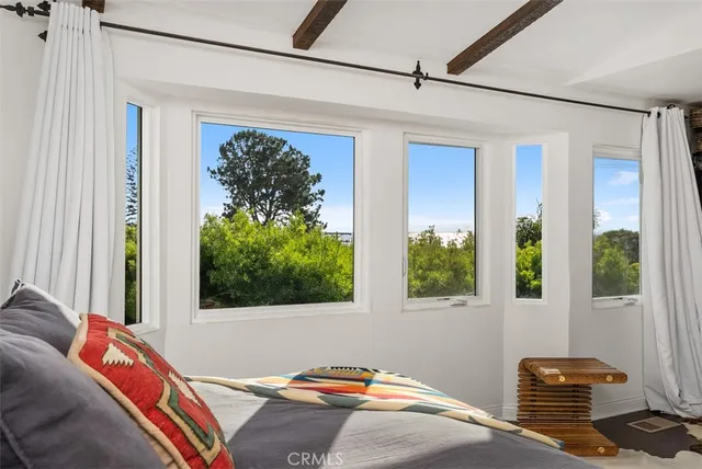 a living room with a couch and a window