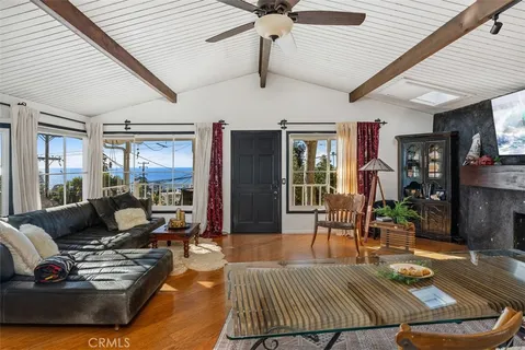 a living room with furniture rug and window