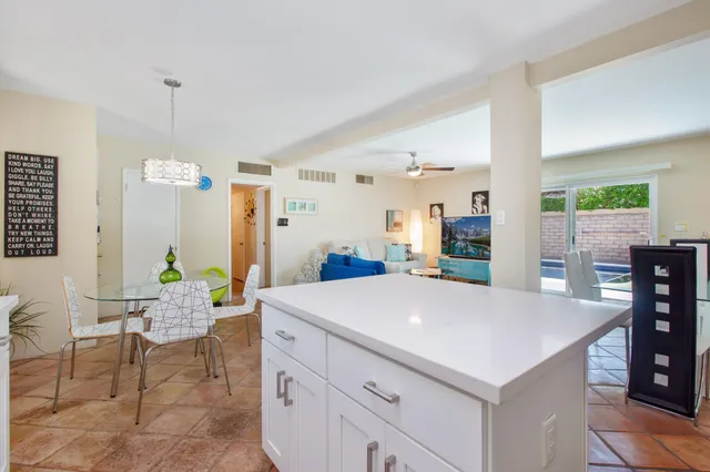 a view of kitchen island with furniture and wooden floor