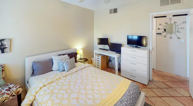 a bedroom with a bed and furniture