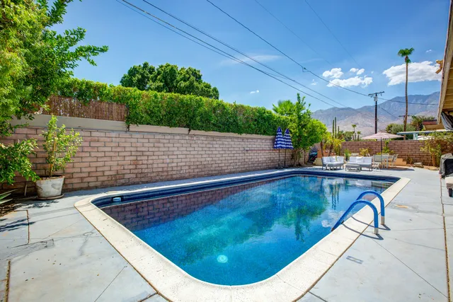 a view of a swimming pool with a patio