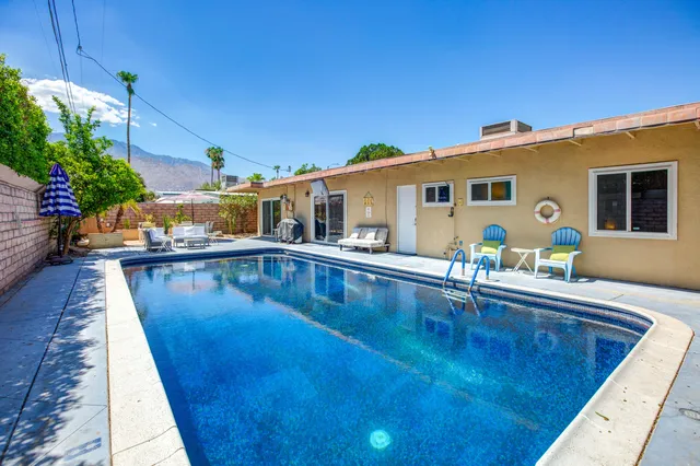 a view of a patio with swimming pool