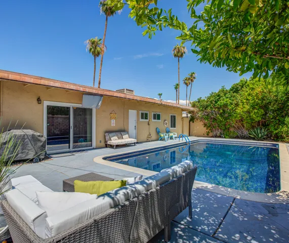 swimming pool with outdoor seating