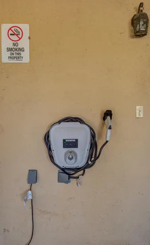 a view of a yard with potted plants