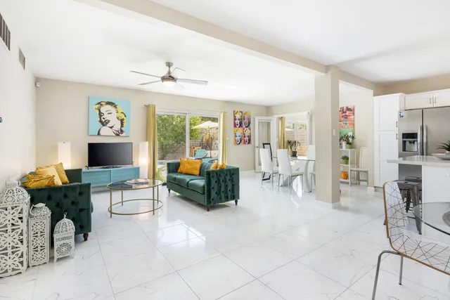 a bedroom with a bed and a flat tv screen