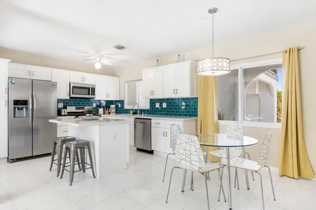 a bathroom with a shower a sink and mirror