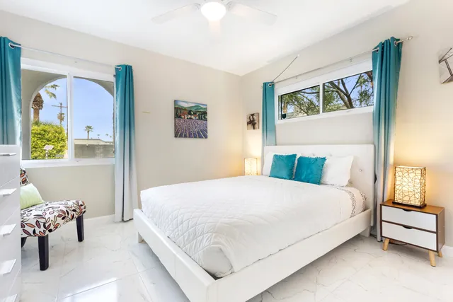 a bathroom with a double vanity sink mirror and shower