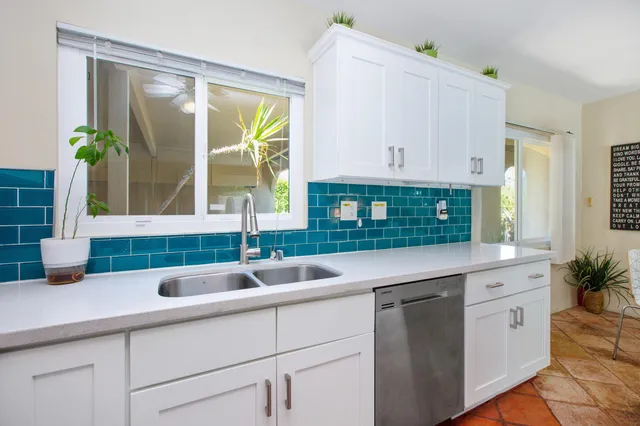 a kitchen with a sink and a window