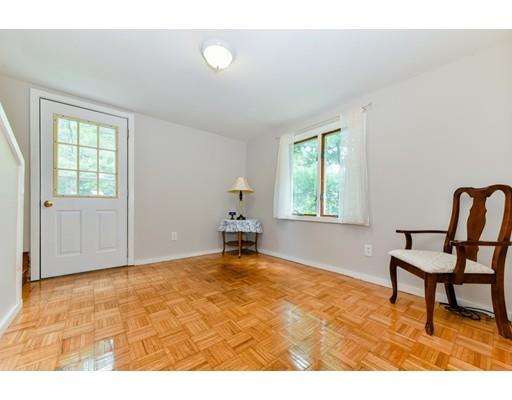 59 Indian Lane Canton, MA 02021 - Photo 11 of 25 a view of a livingroom with wooden floor and a window