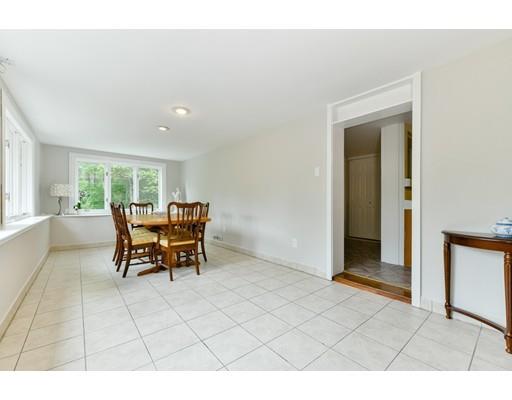59 Indian Lane Canton, MA 02021 - Photo 12 of 25 a dining room with furniture and a floor to ceiling window