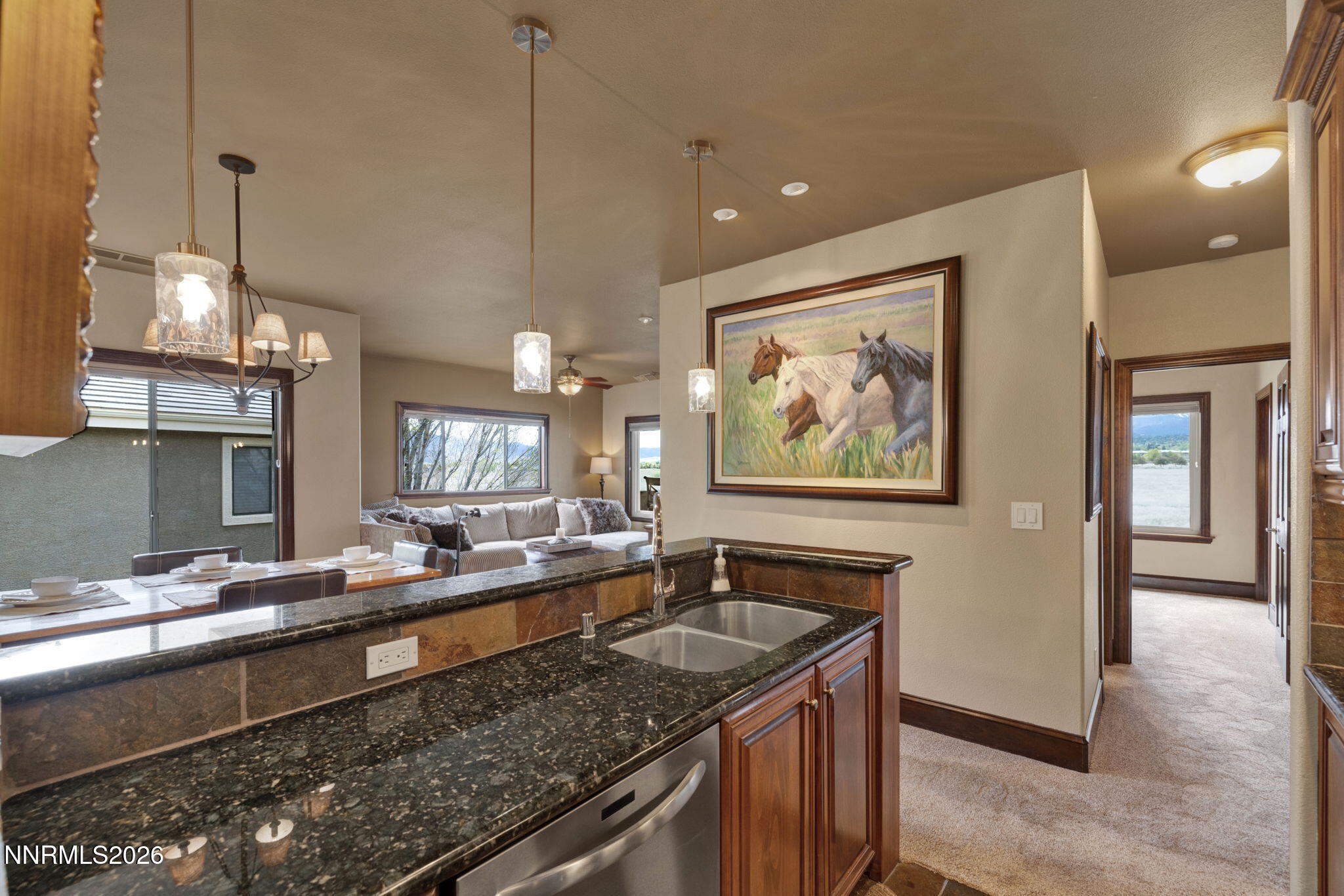 900 South Meadows Parkway, Unit 5121 Reno, NV 89521 - Photo 13 of 39 a kitchen with granite countertop a sink and a stove