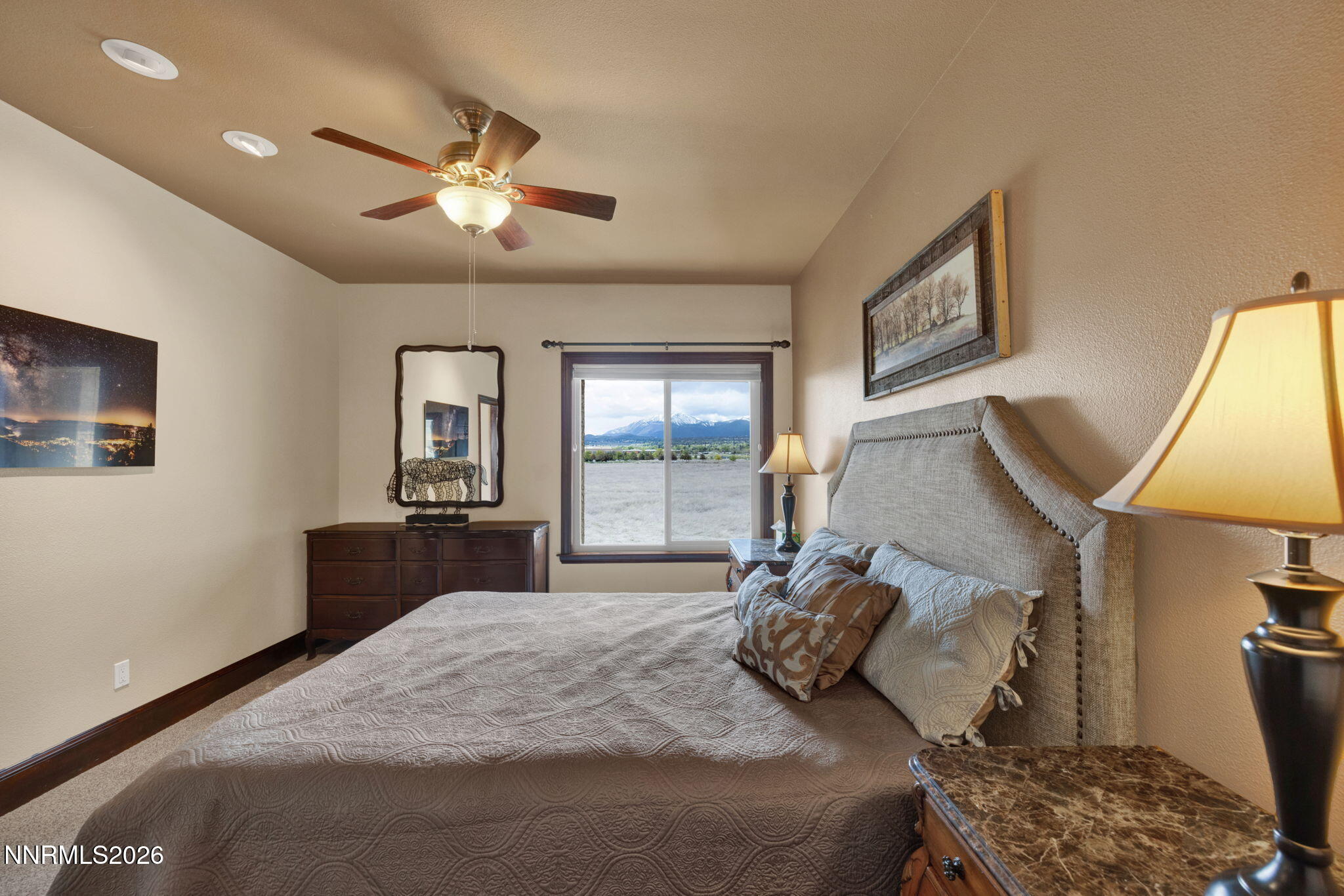 900 South Meadows Parkway, Unit 5121 Reno, NV 89521 - Photo 16 of 39 a bedroom with a bed and wooden floor